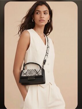 Nicole Miller Black and White Snakeskin Clutch